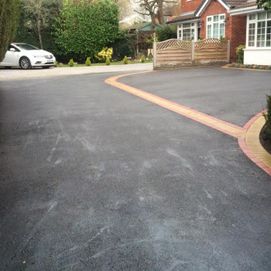 black driveway with car